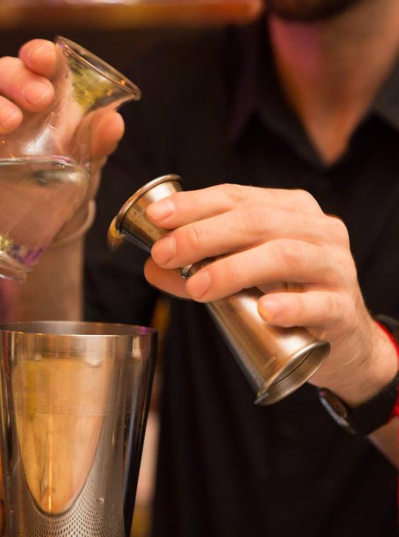 A bartender mixes cocktails at Gallo Negro