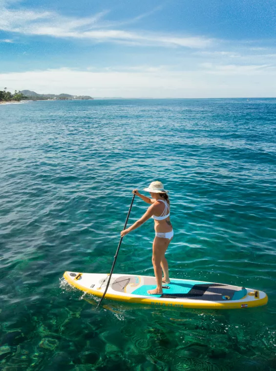 Stand-up paddleboarding at the beach, one of the best things to do in Rincón, Puerto Rico