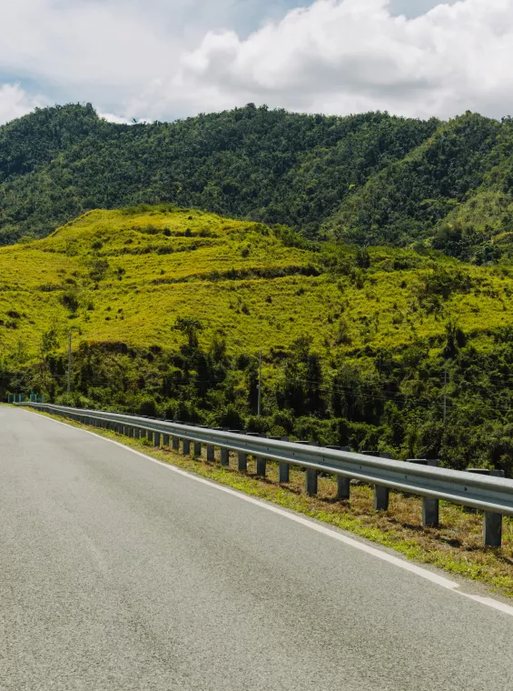 A wide view of a road through Puerto Rico's Mountains. 