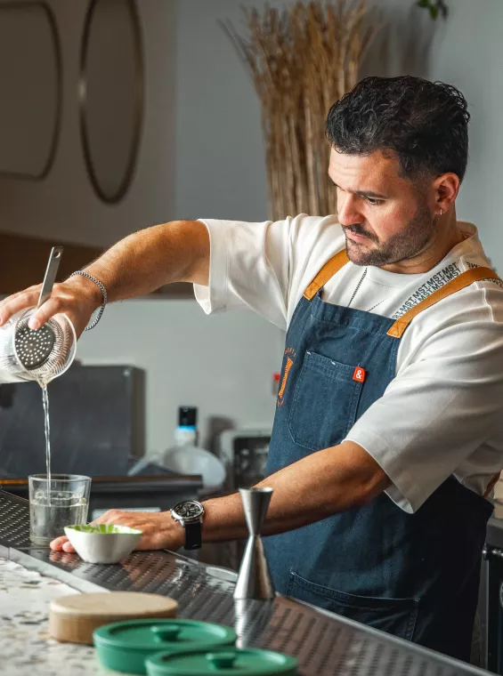 Mixologist Stephen Alonso mixing a cocktail.